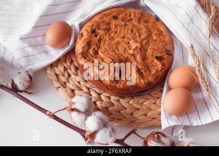Easter cake and eggs on wicker cloth. Isolated on white. Cookies pie or cake recipe Stock Photo