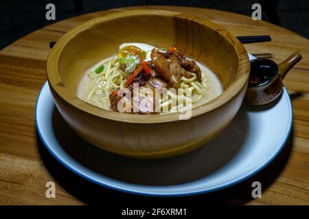 Bowl of Noodle soup with fried chicken Stock Photo