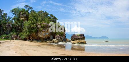 Sandy beach (Telok Paku) with rocks in Bako National Park, Borneo, Sarawak, Malaysia Stock Photo