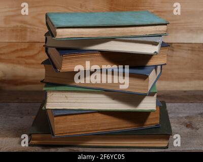 Old shabby books on brown backgrounds from wooden boards. Stock Photo