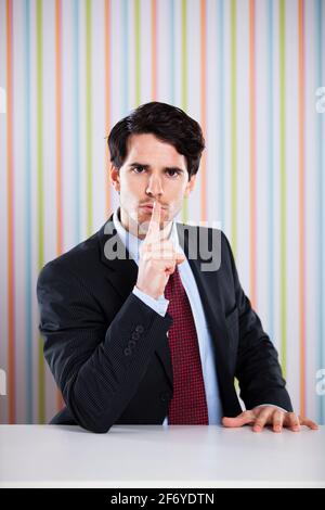 Businessman asking for silence Stock Photo