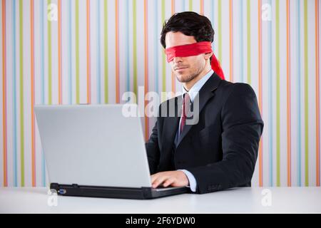Blind businessman working at the office Stock Photo