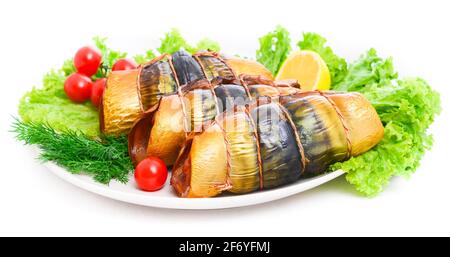 Appetizing smoked fish on a platter Stock Photo