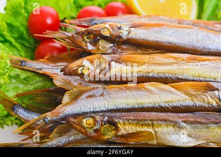 Dried smoked capelin on a plate Stock Photo