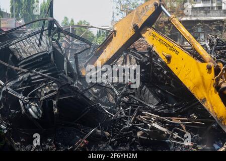 Mumbai , India - 30 March 2021, Burnt rubble and twisted metal from fire in Goregaon West Mumbai Maharashtra India Stock Photo