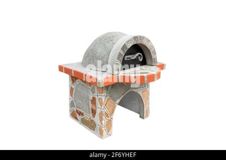 Unused Brick garden furnace with a metal lid for baking or grilling meat, pizza, bread, etc. Isolated on a white background. Stock Photo