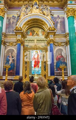 ST. PETERSBURG, RUSSIA - MAY 30, 2017: Tourists visiting the majestic interiors of St. Isaac's Cathedral Stock Photo