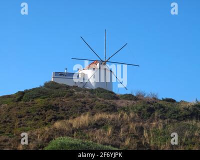 Windmill in beautiful Carraparteira at the Alentejo coast of Portugal Stock Photo