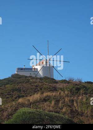 Windmill in beautiful Carraparteira at the Alentejo coast of Portugal Stock Photo