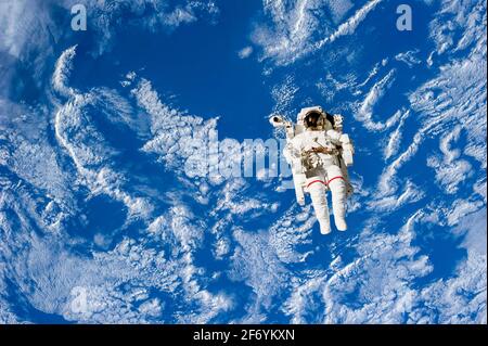 astronaut in outer space on earth planet background,Elements of this image furnished by NASA illustration Stock Photo