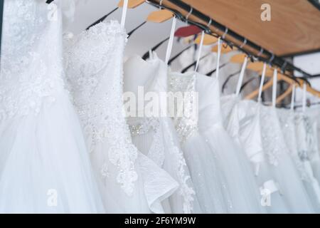 Close up white Wedding Dresses in dress store, Bride dress Stock Photo