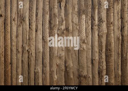 Rough old wooden logs texture or wall with vertical pattern. Stock Photo