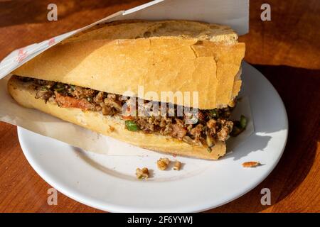 Traditional local Turkish street food. Kokorec with bread Stock Photo