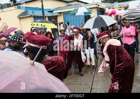 Lady Buckjumpers New Orleans Social Aid and Pleasure Club Second Line (Secondline) Parade dancers on Sunday in the rain. New Orleans, Louisiana, USA. Stock Photo