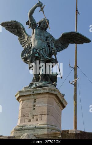 Close-up of Saint Michael sculpture at the top of Sant'Angelo Castle at Rome against a clear blue sky Stock Photo