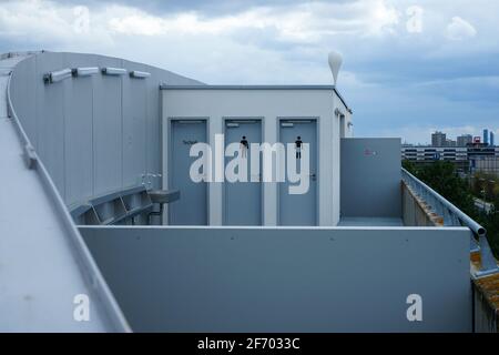 Allianz Arena during the Corona Lockdown. Where tourists and fans usually bustle about, craftsmen and employees work, there is yawning emptiness.. Stock Photo