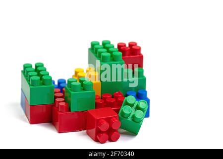 Colorful plastic building blocks against a white background Stock Photo