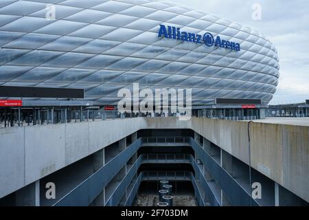 Allianz Arena during the Corona Lockdown. Where tourists and fans usually bustle about, craftsmen and employees work, there is yawning emptiness.. Stock Photo