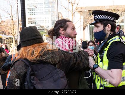 Manchester, UK. 3rd April, 2021. Protestor comes eye to eye with policeman as Kill the Bill protestors protest in Manchester. Credit: Gary Roberts/Alamy Live News