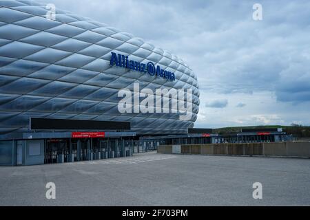 Allianz Arena during the Corona Lockdown. Where tourists and fans usually bustle about, craftsmen and employees work, there is yawning emptiness.. Stock Photo