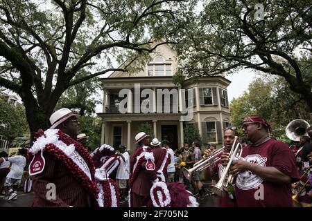 Young Men Olympians, New Orleans Social Aid and Pleasure Club Second Line (Secondline) Parade dancers on Second Line Sunday. New Orleans, Louisiana. Stock Photo