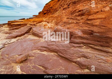 At Cavendish beach, on Canada's Prince Edward Island, the red sandstone weathered with yellow sand created a stunning pattern from eons of erosion aga Stock Photo
