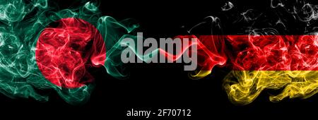 Bangladesh, Bangladeshi vs Germany, German, Deutschland smoky mystic flags placed side by side. Thick colored silky abstract smokes flags. Stock Photo