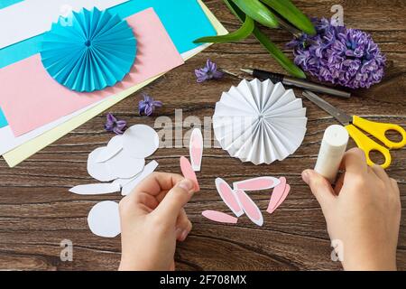 Instruction step 6. Children's paper decor. Funny paper easter bunny. Easter handmade Project of children's creativity, handicrafts, crafts for kids. Stock Photo