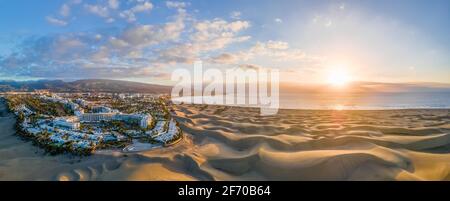 Landscape with Maspalomas town and golden sand dunes at sunrise, Gran Canaria, Canary Islands, Spain Stock Photo
