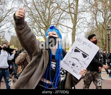 London, UK. 03rd Apr, 2021. A woman gestures and joins in a chant aimed towards the Buckingham Palace, demanding the new policing bill be dropped. London. Anna Hatfield/ Pathos Images Credit: One Up Top Editorial Images/Alamy Live News