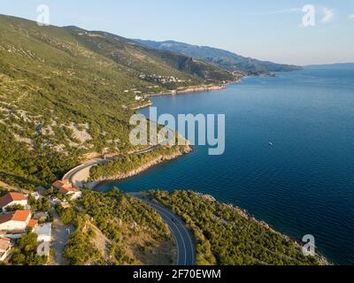 Scenic view of the coastline of croatia in the summer with mountains and blue sea with a road along the coastline Stock Photo