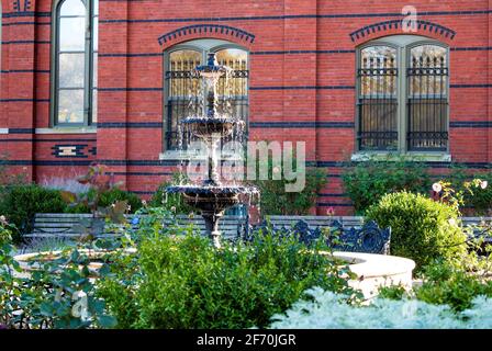 fountain in the middle of this beautiful colonial garden Stock Photo