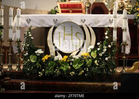 The bishop grants the Sacrament of Confirmation in a large Christian Church Stock Photo