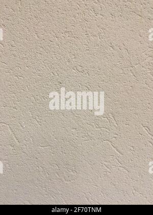 Beige plaster wall texture with rough cement finish Stock Photo