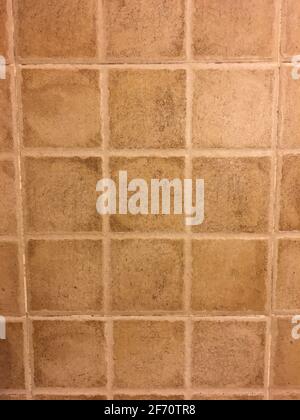 Terracotta square tiles background with rustic grout lines Stock Photo