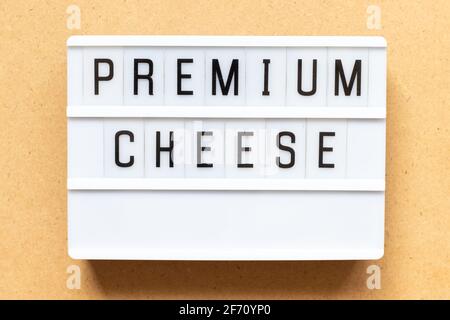 Lightbox with word premium cheese on wood background Stock Photo