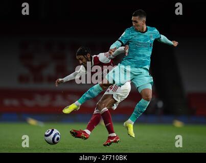 London, UK. 4th Apr, 2021. Liverpool's Roberto Firmino (R) challenges Arsenal's Pierre-Emerick Aubameyang during the Premier League match between Arsenal and Liverpool at the Emirates Stadium in London, Britain, on April 3, 2021. Credit: Xinhua/Alamy Live News Stock Photo