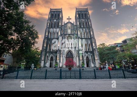 St. Joseph's Cathedral is a church on Nha Tho (Church) Street in the Hoan Kiem District of Hanoi, Vietnam. Its a late 19th century Gothic Revival (Neo Stock Photo