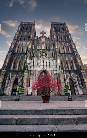 St. Joseph's Cathedral is a church on Nha Tho (Church) Street in the Hoan Kiem District of Hanoi, Vietnam. Its a late 19th century Gothic Revival (Neo Stock Photo