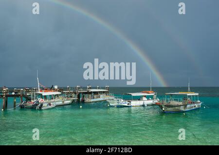 Rainbow over the Coral Sea at Heron Island, Southern Great Barrier Reef, Queensland, QLD, Australia Stock Photo