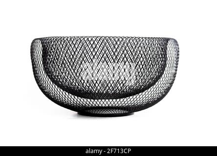 Black metal mesh bowl, front view. Decorative large double walled wire mesh dish. Used to store, organize or showcase items such as fruit, bread, cand Stock Photo