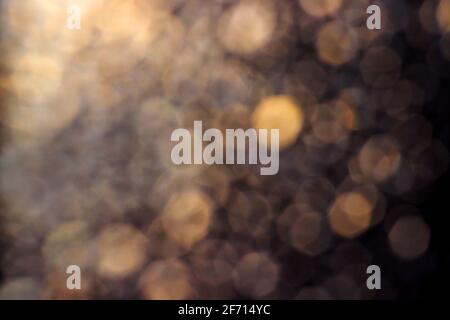 Abstract yellow-brown bokeh background in different shades of grey-yellow colors. Stock Photo