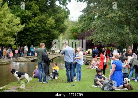 Scenes in the Cotswold village of Bourton-on-the-Water which is experiencing unprecedented visitor numbers during the Coronavirus pandemic (Aug 2020) Stock Photo