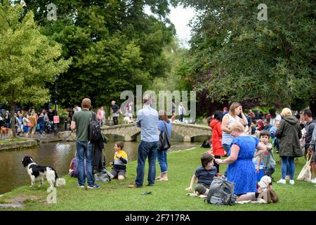 Scenes in the Cotswold village of Bourton-on-the-Water which is experiencing unprecedented visitor numbers during the Coronavirus pandemic (Aug 2020) Stock Photo