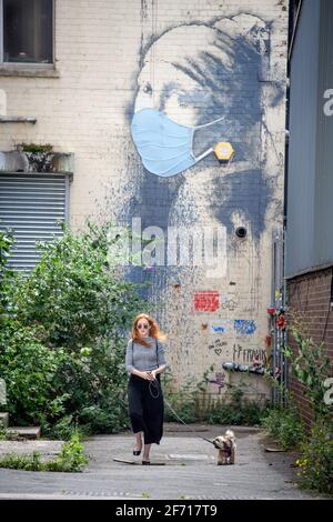 The Coronavirus inspired adaptation of Vermeer’s Girl With A Pearl Earing attributed to Banksy in Bristol, UK Stock Photo