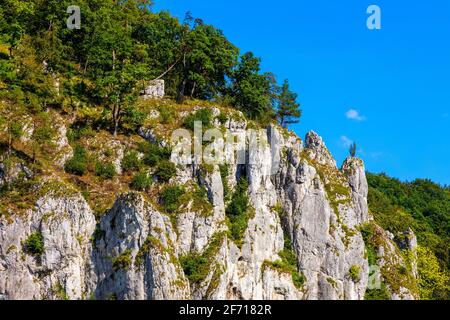 Crown rocks - Skaly Koronne - Jurassic massif with Glove Rock - Rekawica - in Pradnik creek valley of Cracow-Czestochowa upland in Ojcow in Poland Stock Photo