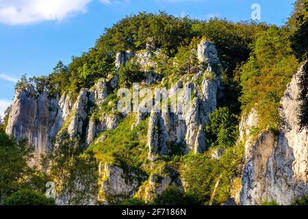 Crown rocks - Skaly Koronne - Jurassic massif with Glove Rock - Rekawica - in Pradnik creek valley of Cracow-Czestochowa upland in Ojcow in Poland Stock Photo