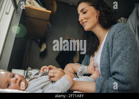 Woman changing her clothes Stock Photo - Alamy