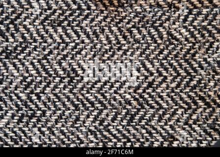 Light grey woolen or tweed fabric for grunge background. Stock Photo