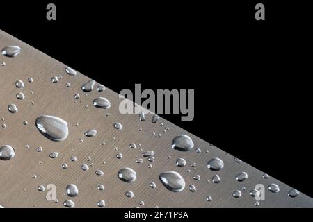 drops of water on a brushed steel surface. Stock Photo